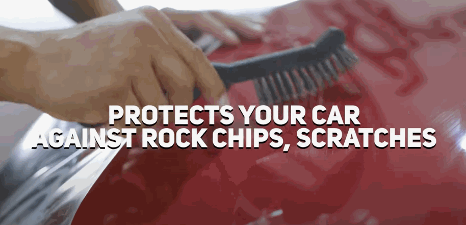 A brush touches the paint of a red car with clear film underneath. The text “PROTECTS YOUR CAR AGAINST ROCK CHIPS. SCRATCHES” appears across the center.